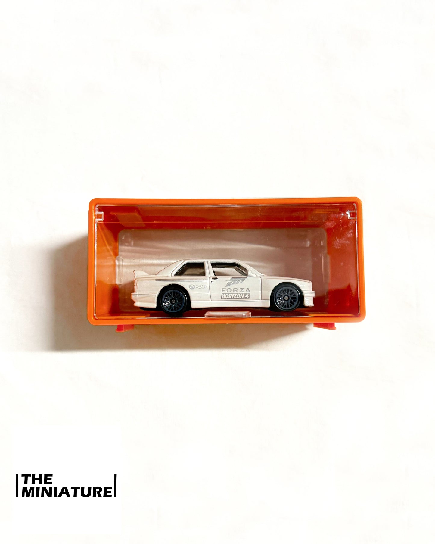Miniature ShowBox Clear – Gray/Orange Frame (1:64 Collector Case)