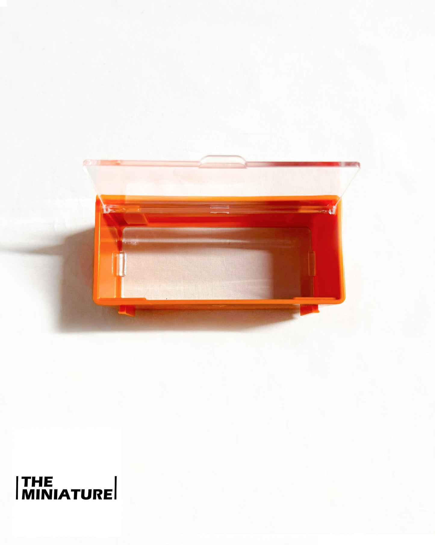 Miniature ShowBox Clear – Gray/Orange Frame (1:64 Collector Case)